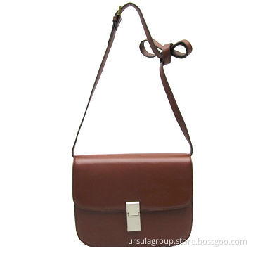 Small cross bag with lock closure on front flap
